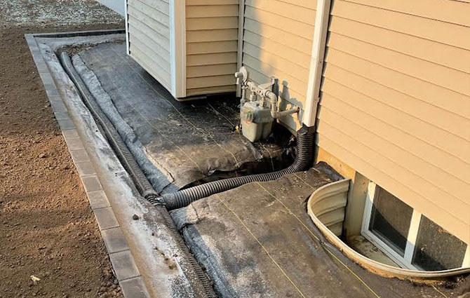 rain gutter drainage, downspout run-off to be covered with landscaping - Chatham, IL